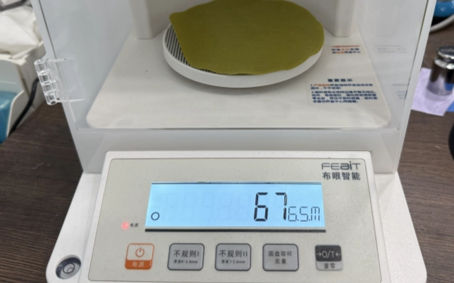 Fabric sample weight measurement during textile testing