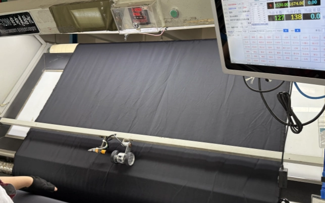 Fabric inspection machine checking woven fabric quality