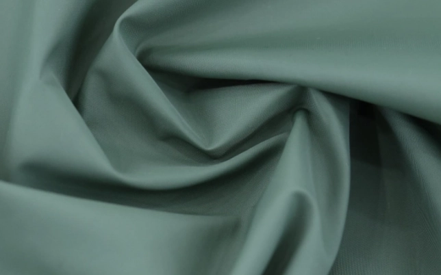 Soft green fabric showing drape and hand feel