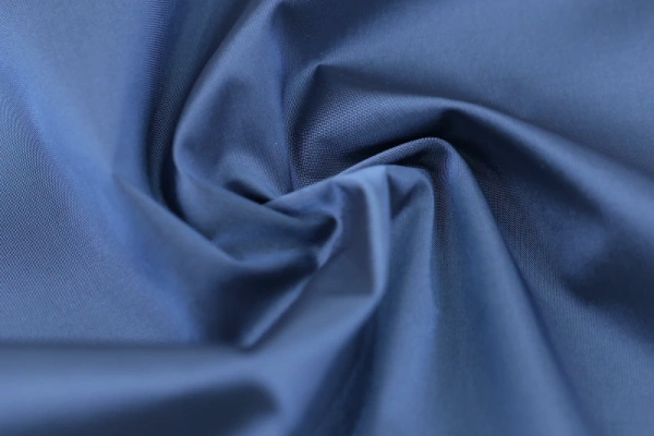 Blue apparel fabric showing drape and smooth hand feel