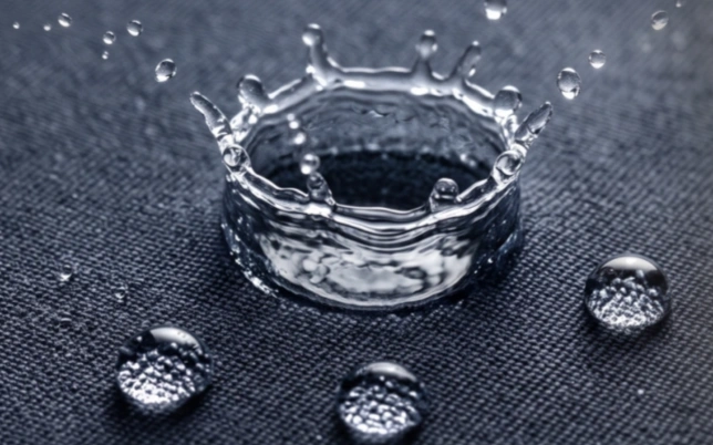 Water droplets on water-repellent fabric surface